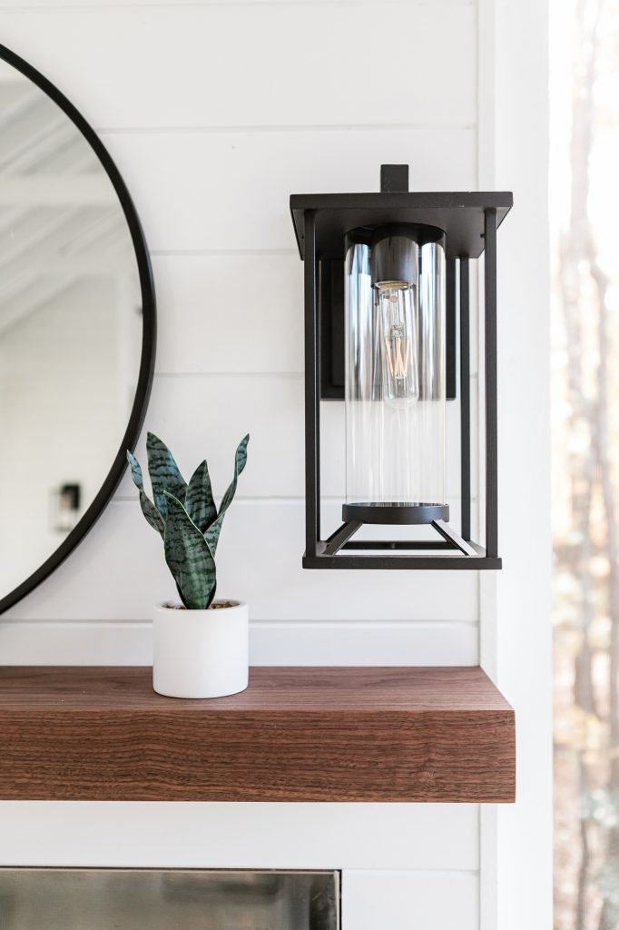 Custom outdoor Screen Porch with Scandinavian accents and amazing sconces