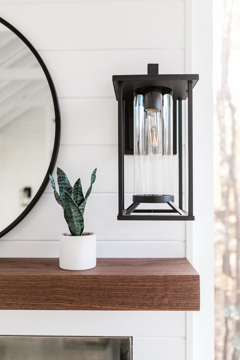 Custom outdoor Screen Porch with Scandinavian accents and amazing sconces