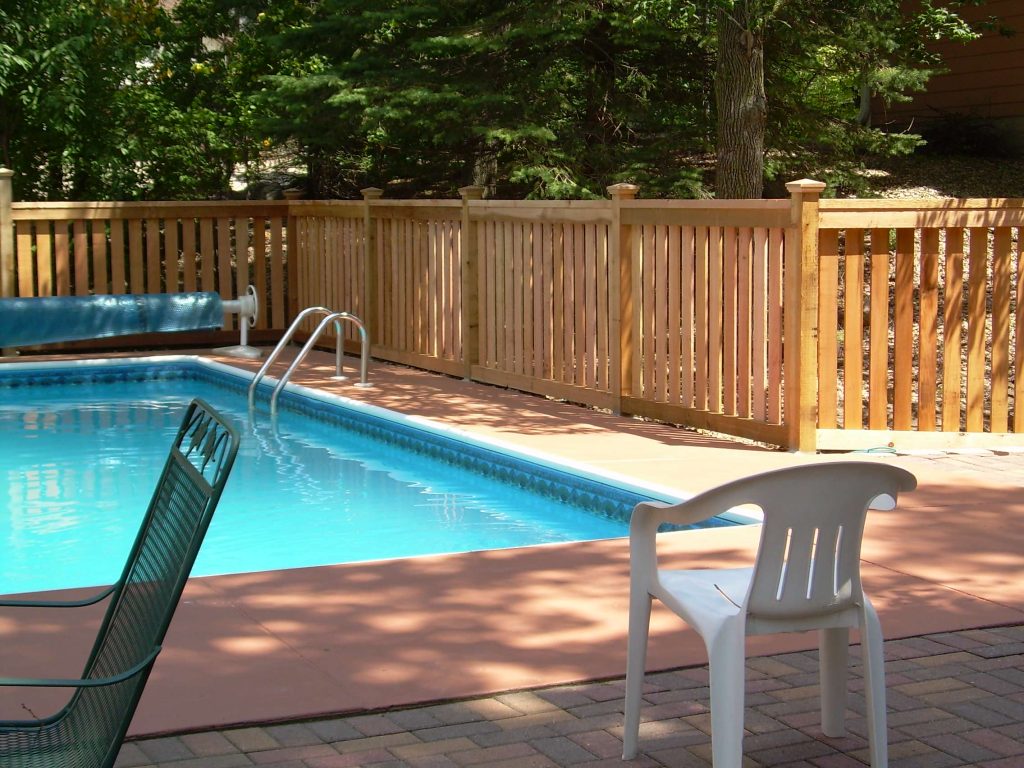 Custom pool fence designed & installed by Dakota Unlimited.