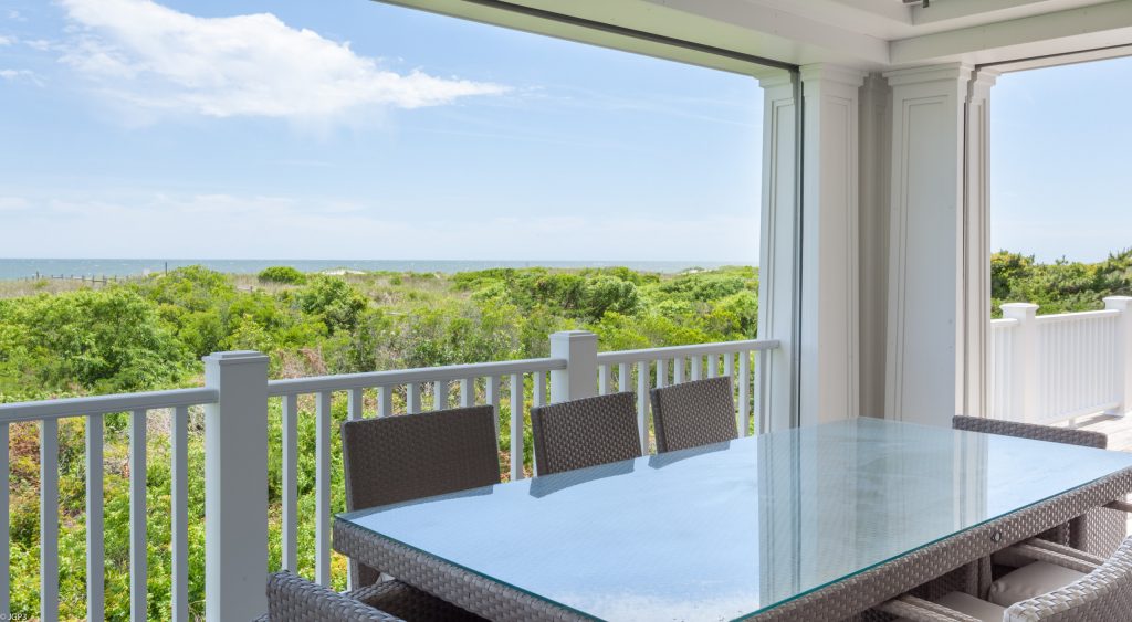 Custom screen porch with storm shutters