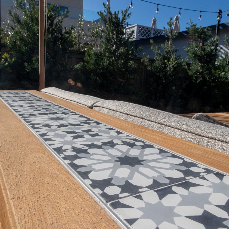 Custom teak bench with handmade tile inlay