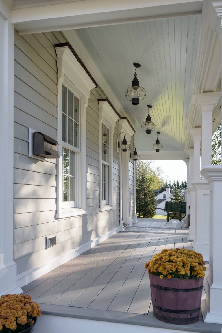 Custom wraparound porch with Wolf PVC composite decking, high gloss beaded ceiling, and hand crafted PVC architectural columns. Built for the harsh shoreline weather. by Advantage Contracting | Outdoor Photos | Porch | Landscaping | Landscape Design | Outdoor Living Space | Porch Design Ideas | Outdoor Living Space Ideas | Backyard Design
