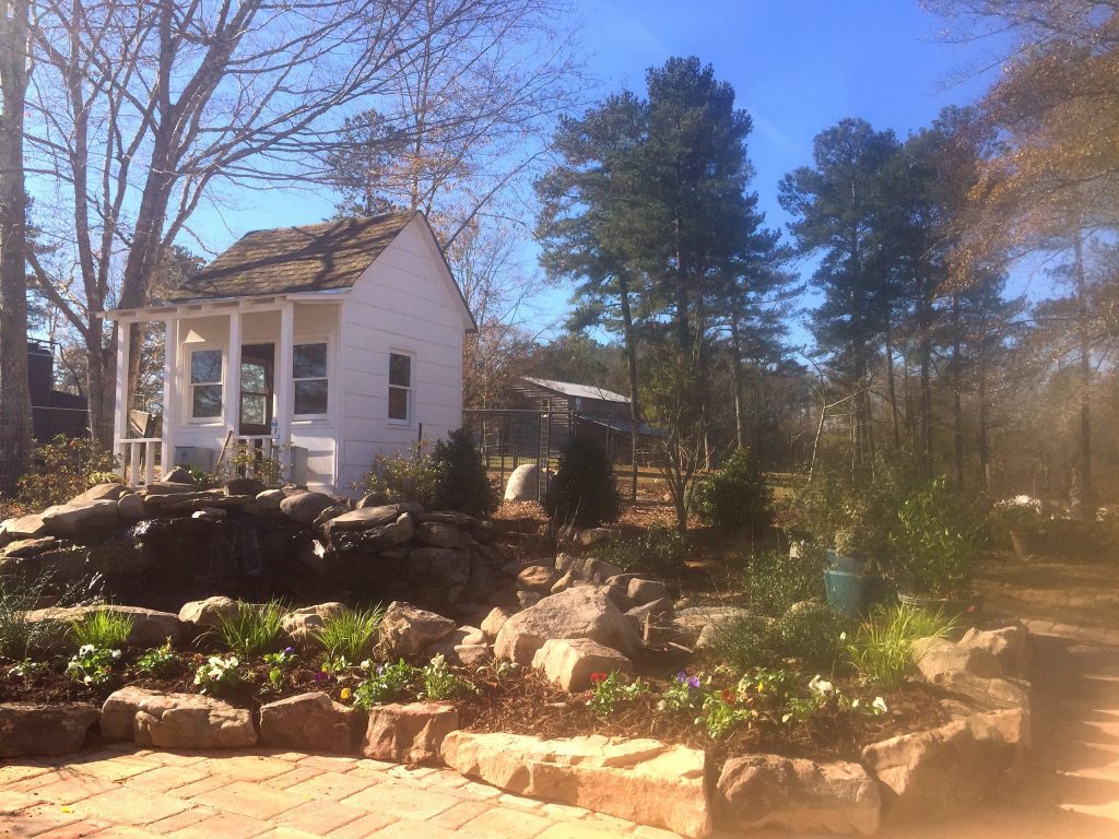 Daco Garden waterfall into a pond surrounded by natural stone and boulders