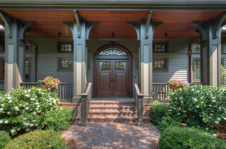 Dark Wood Double Door, Natural Fir Ceiling, and Painted Wood Columns with Brackets