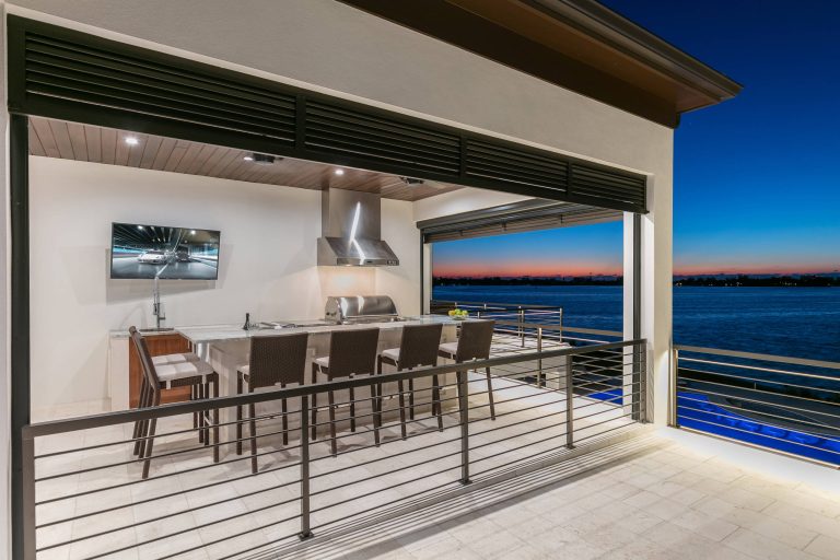 Deck - coastal deck idea in Tampa with a roof extension