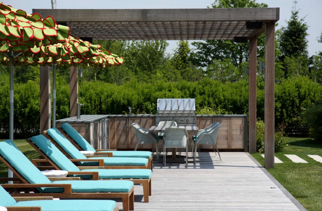 Deck - country deck idea in New York with a pergola