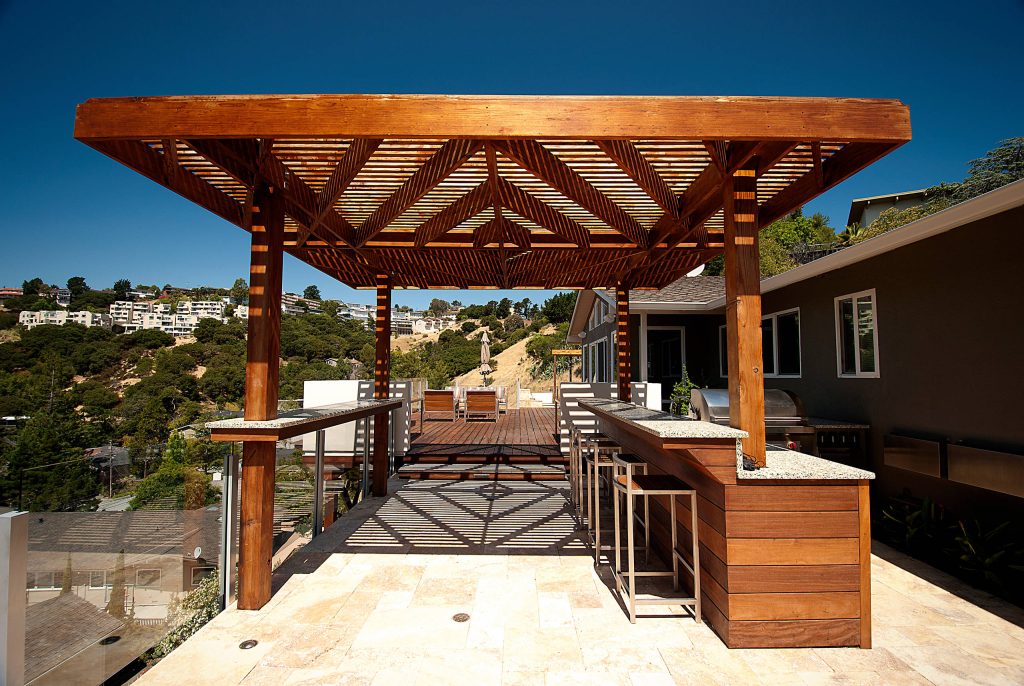 Deck - large contemporary backyard deck idea in San Francisco with a pergola