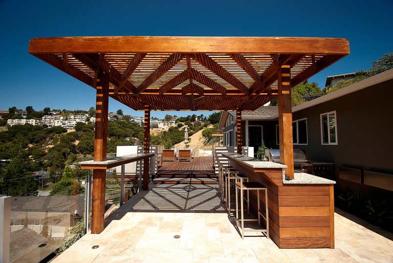 Deck - large contemporary backyard deck idea in San Francisco with a pergola