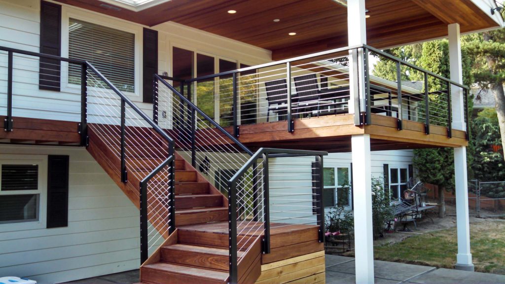 Deck - mid-sized craftsman backyard deck idea in Portland with a roof extension