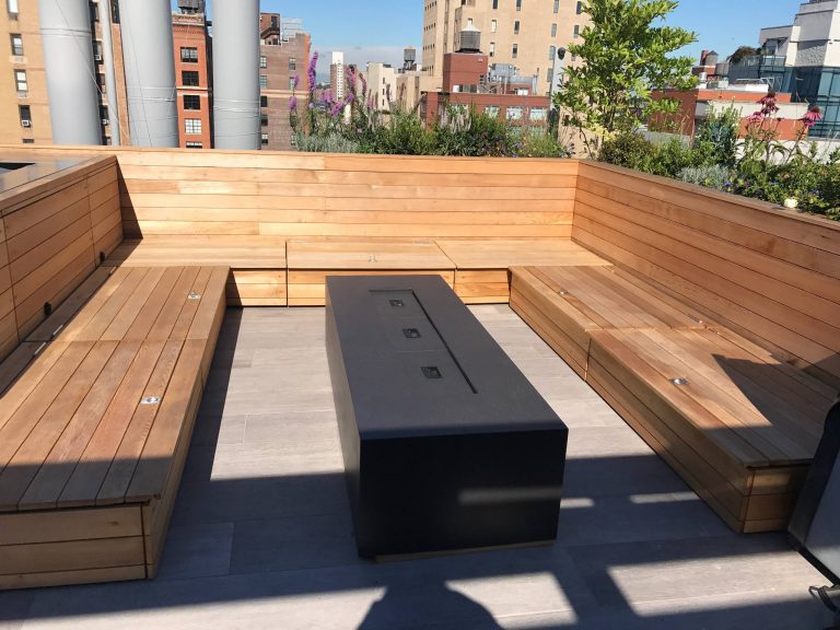 Deck - mid-sized modern rooftop deck idea in New York with a fire pit and no cover