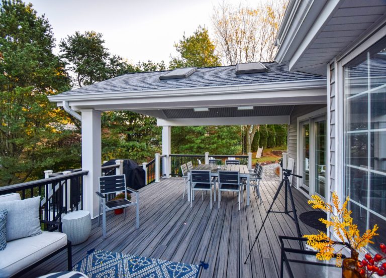 Deck - mid-sized transitional backyard deck idea in Other with a roof extension