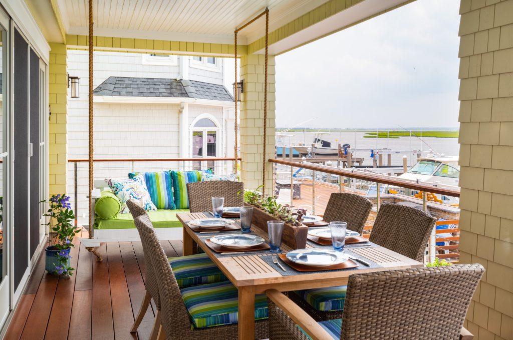 Deck - small coastal deck idea in Philadelphia with a roof extension