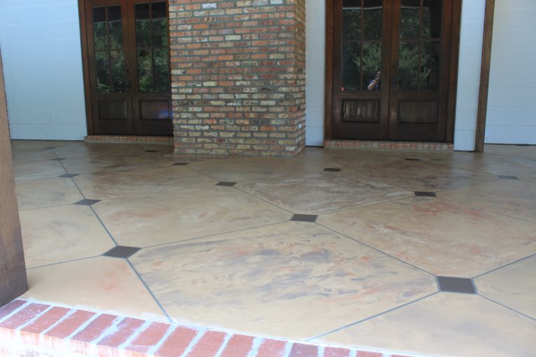 Decorative concrete made to look like big tile. The bottom line of brick on chimney and in door step were matched to the chimney brick using decorative concrete by Decorative Concrete Coatings, LLC | Outdoor Photos | Porch | Landscaping | Landscape Design | Outdoor Living Space | Porch Design Ideas | Outdoor Living Space Ideas | Backyard Design