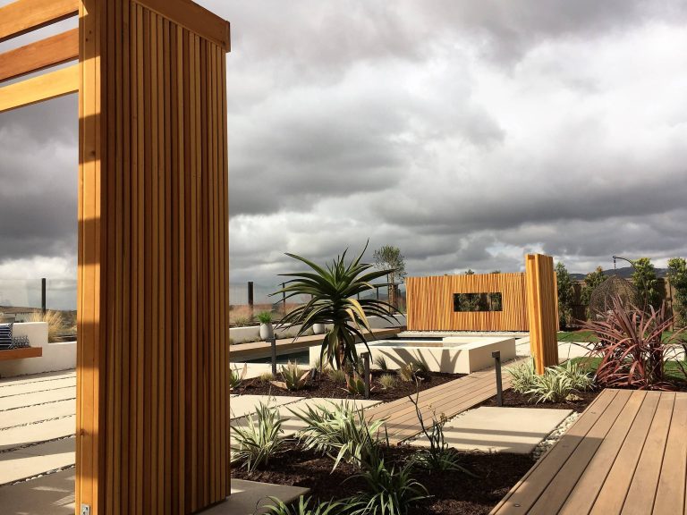 Design ideas for a contemporary drought-tolerant and full sun backyard concrete paver landscaping in San Diego.