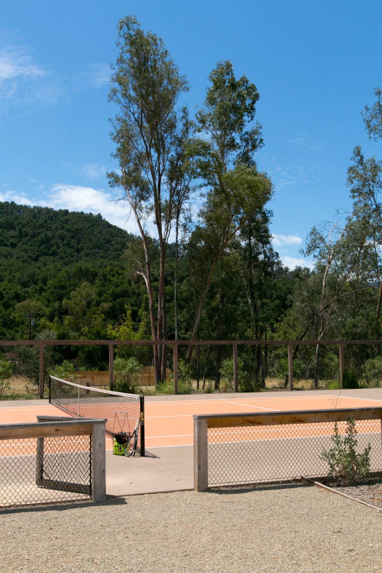 Design ideas for a farmhouse backyard outdoor sport court in Los Angeles.