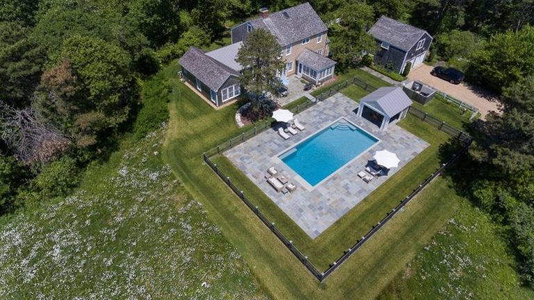 Design ideas for a large farmhouse full sun backyard stone landscaping in Boston.