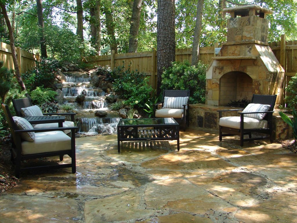 Design ideas for a large traditional partial sun backyard stone formal garden in Nashville with a fire pit for summer.