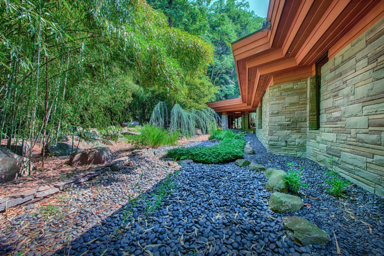 Design ideas for a mid-sized asian drought-tolerant backyard gravel landscaping in Philadelphia.