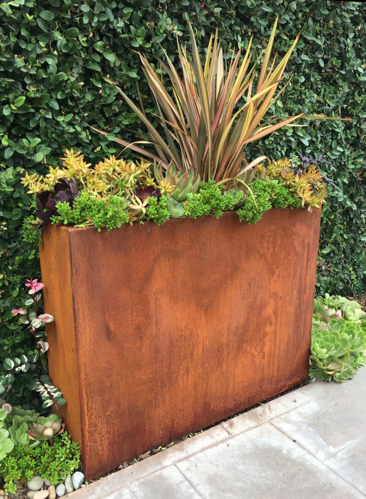 Design ideas for a mid-sized industrial backyard concrete paver landscaping in Other.