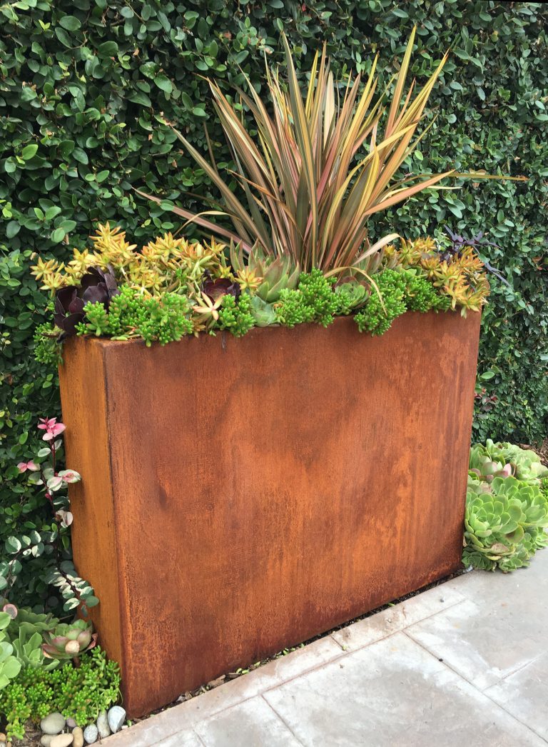 Design ideas for a mid-sized industrial backyard concrete paver landscaping in Other.