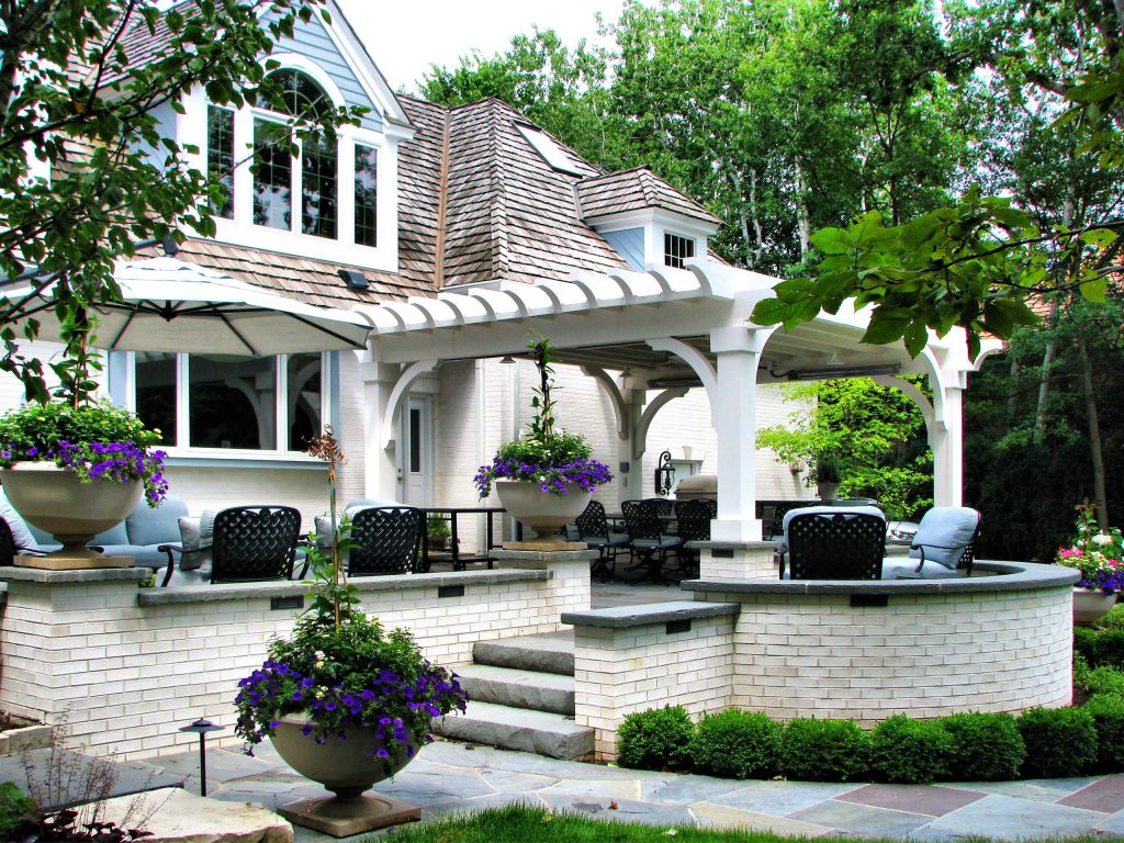 Designed by: Marco Romani, Landscape Architect. Outdoor Kitchen, Heated Pergola, Outdoor Lounge Room, Terraced Patio, Retaining Walls and Seatwalls, Landscape, Outdoor Seating Furniture.