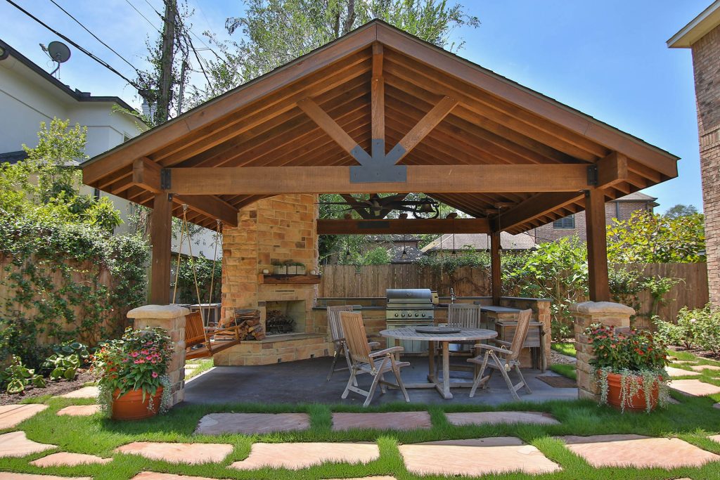 Detached covered patio made of custom milled cypress which is durable and weather-resistant. Amenities include a full outdoor kitchen, masonry wood burning fireplace and porch swing.