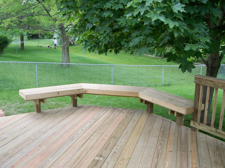 Diagonal decking with a wood bench.