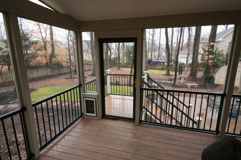 Dog door built into screen porch