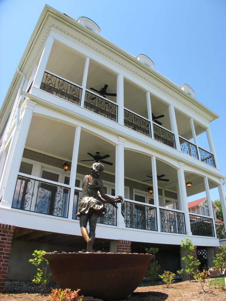 Double decker porch with water view.