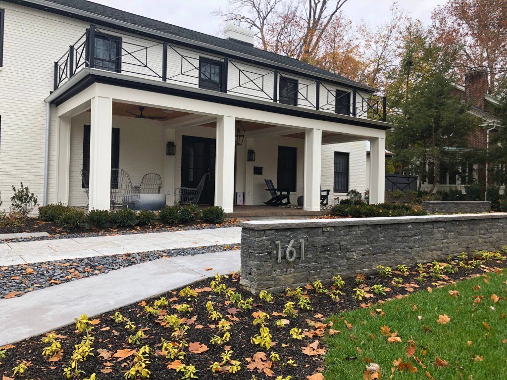 Dry stack address wall and limestone walkway.