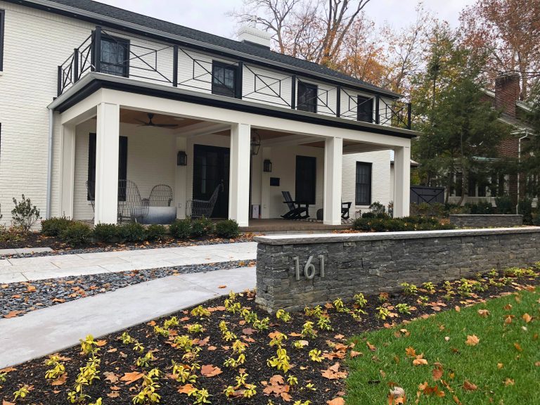 Dry stack address wall and limestone walkway.