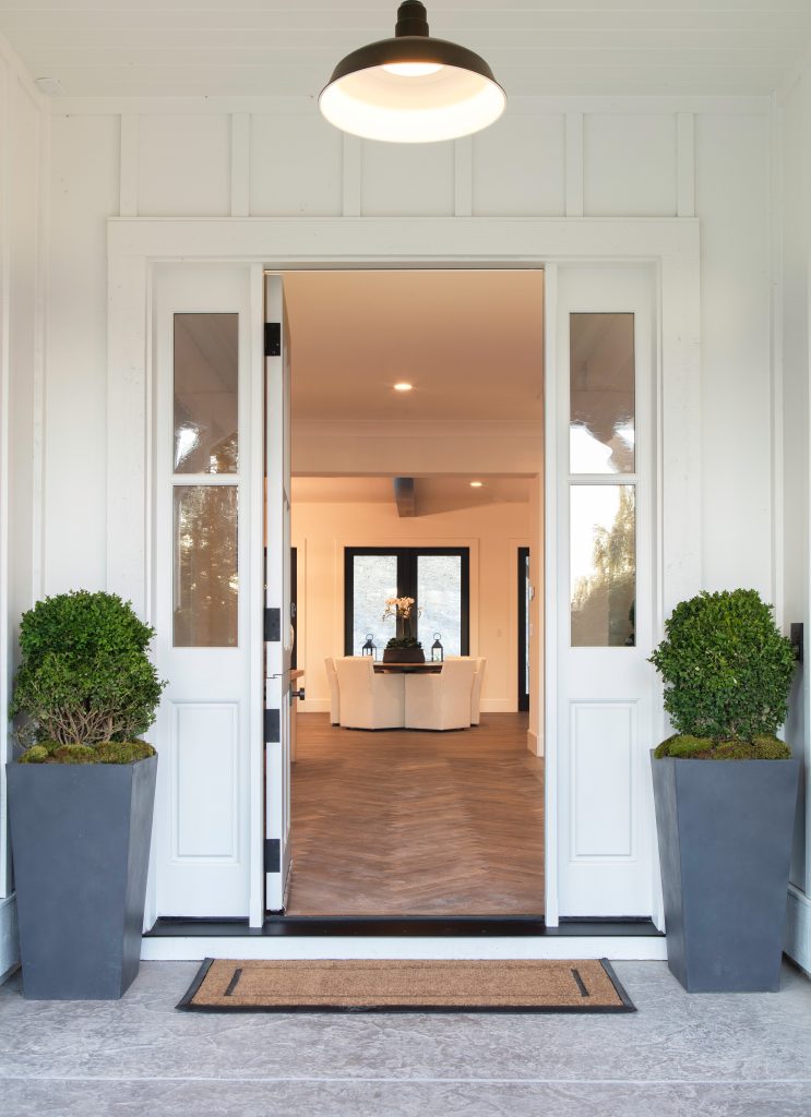 Dutch door entry with sidelights leading to the herringbone entry.