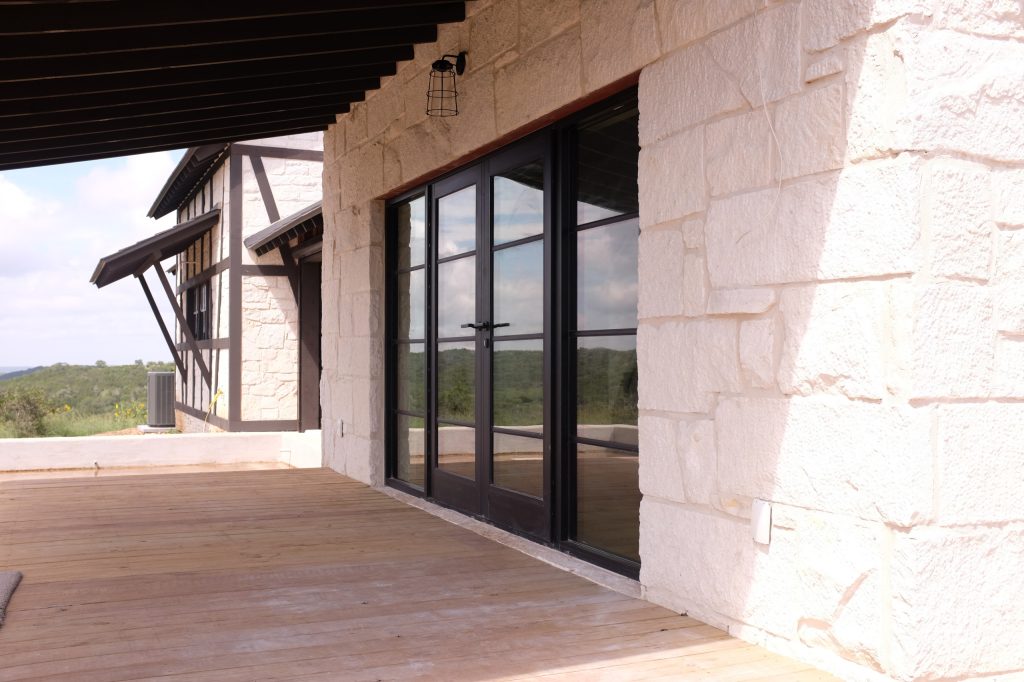 Eclectic back porch photo in Austin with decking and a roof extension by Koviak Built | Outdoor Photos | Porch | Landscaping | Landscape Design | Outdoor Living Space | Porch Design Ideas | Outdoor Living Space Ideas | Backyard Design