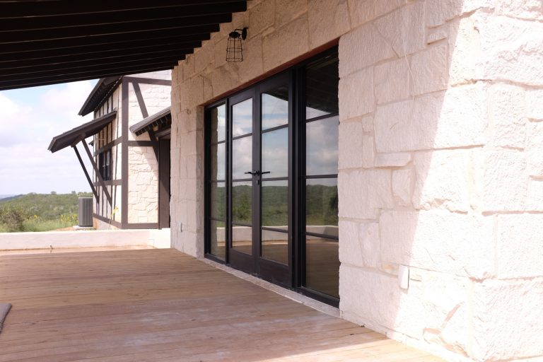 Eclectic back porch photo in Austin with decking and a roof extension by Koviak Built | Outdoor Photos | Porch | Landscaping | Landscape Design | Outdoor Living Space | Porch Design Ideas | Outdoor Living Space Ideas | Backyard Design