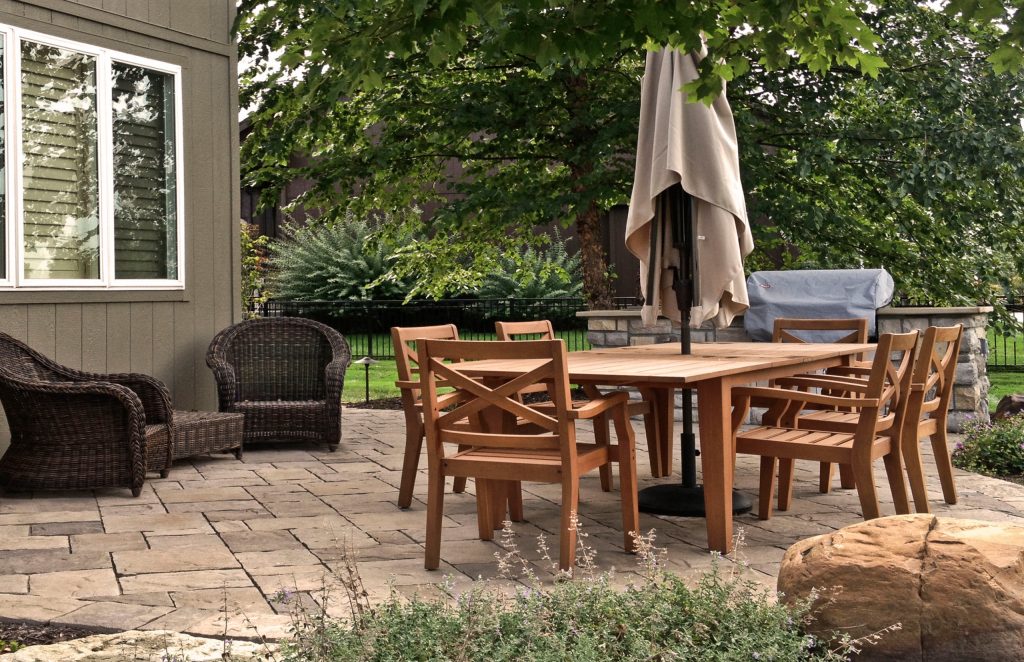 Elegant concrete paver patio kitchen photo in Kansas City
