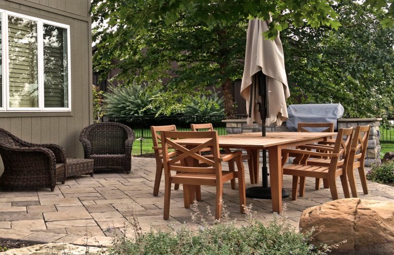 Elegant concrete paver patio kitchen photo in Kansas City