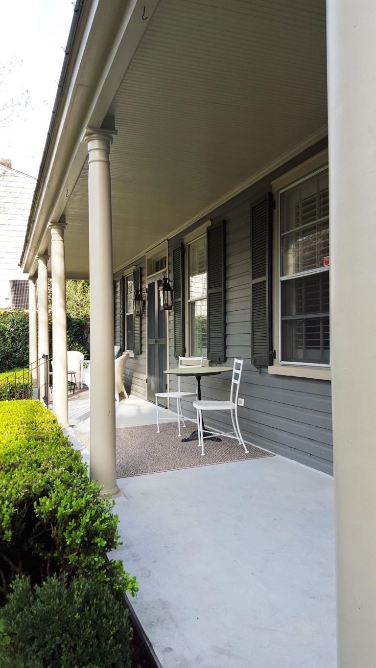 Elegant front porch photo in Charleston with a roof extension by Cannon Contracting | Outdoor Photos | Porch | Landscaping | Landscape Design | Outdoor Living Space | Porch Design Ideas | Outdoor Living Space Ideas | Backyard Design