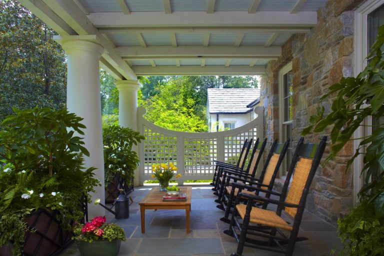 Elegant porch photo in Atlanta with a roof extension by Land Plus Associates, Ltd | Outdoor Photos | Porch | Landscaping | Landscape Design | Outdoor Living Space | Porch Design Ideas | Outdoor Living Space Ideas | Backyard Design