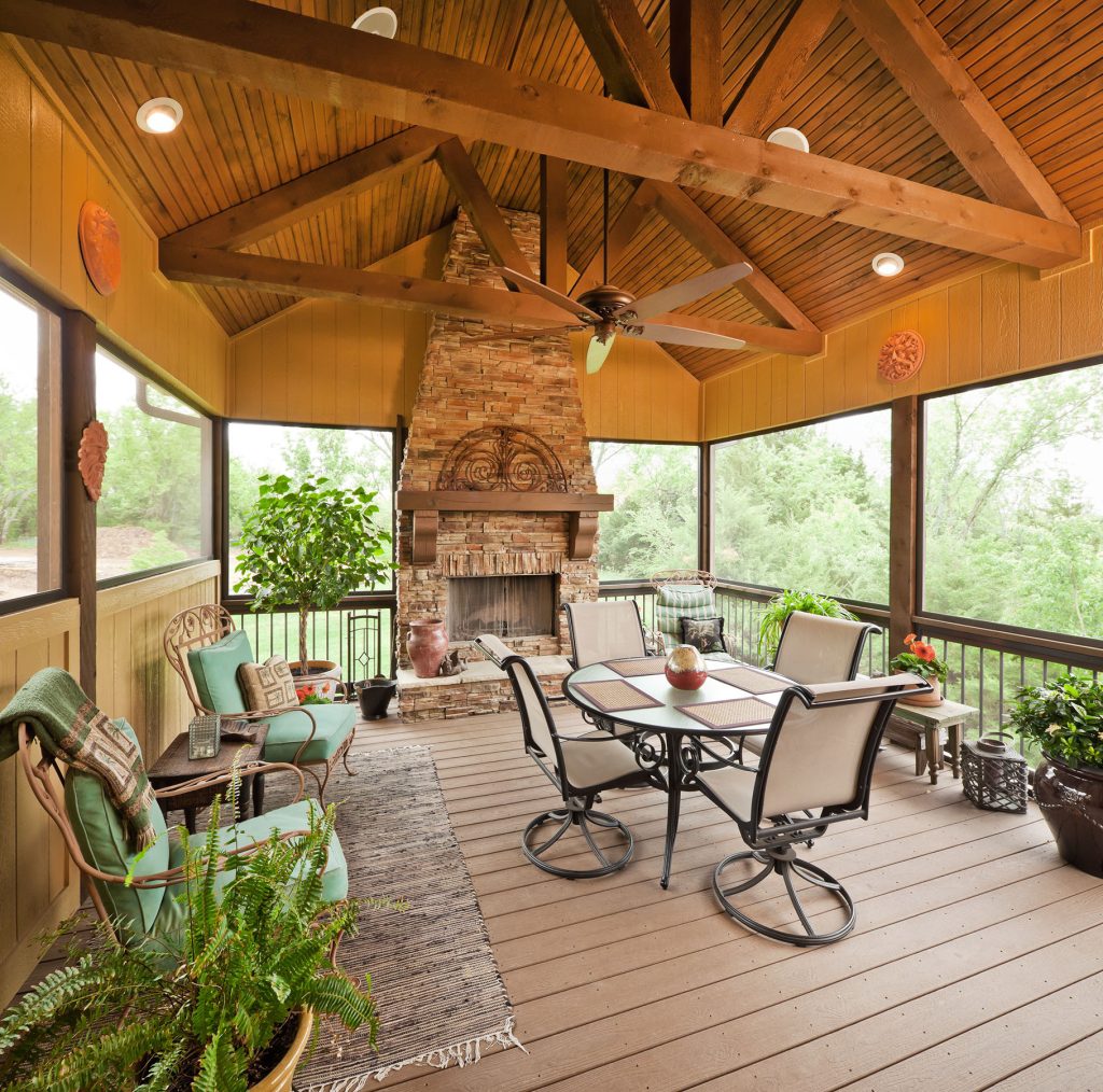 Elegant porch photo in Kansas City with a fire pit, decking and a roof extension by Starr Homes | Outdoor Photos | Porch | Landscaping | Landscape Design | Outdoor Living Space | Porch Design Ideas | Outdoor Living Space Ideas | Backyard Design