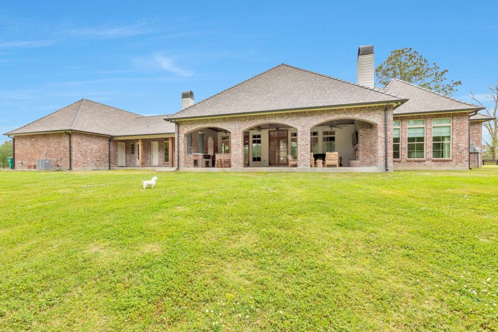 Elegant porch photo in New Orleans by CM Combs Homes, LLC | Outdoor Photos | Porch | Landscaping | Landscape Design | Outdoor Living Space | Porch Design Ideas | Outdoor Living Space Ideas | Backyard Design