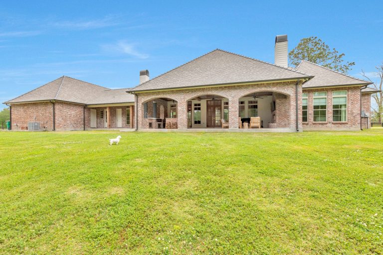 Elegant porch photo in New Orleans by CM Combs Homes, LLC | Outdoor Photos | Porch | Landscaping | Landscape Design | Outdoor Living Space | Porch Design Ideas | Outdoor Living Space Ideas | Backyard Design