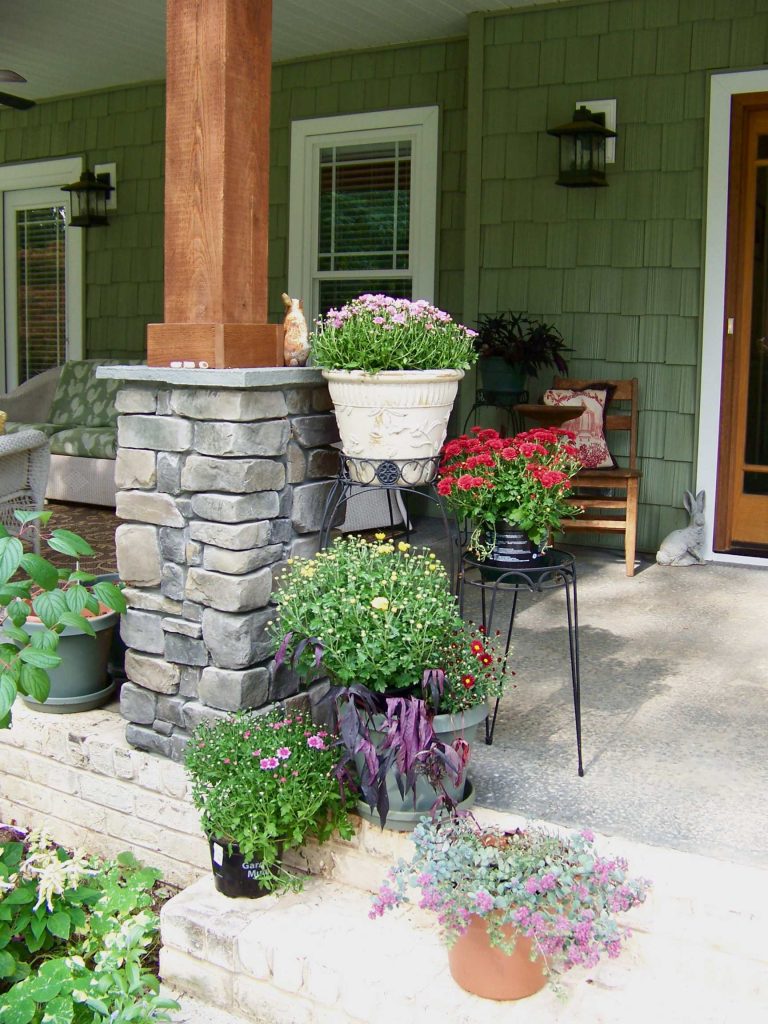 Elegant porch photo in Other with a roof extension by Anna Looper | Outdoor Photos | Porch | Landscaping | Landscape Design | Outdoor Living Space | Porch Design Ideas | Outdoor Living Space Ideas | Backyard Design