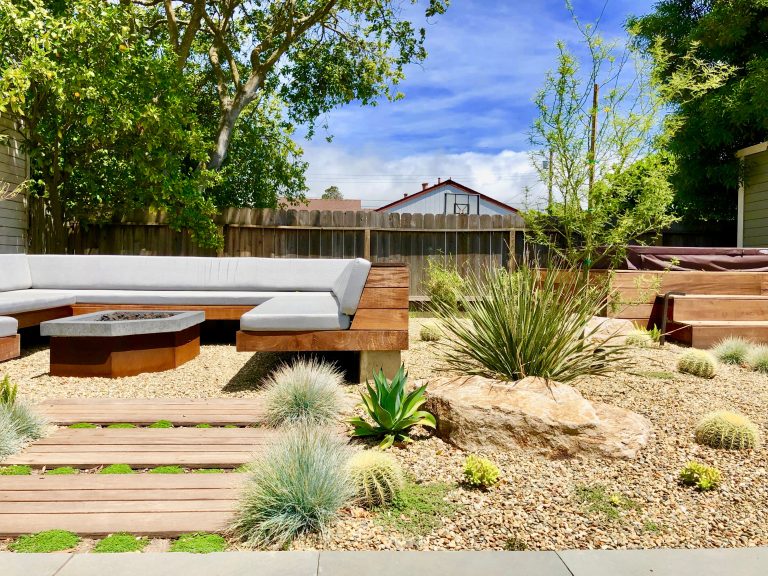 Elements: Custom-built concrete & steel firepit, floating stucco bench, wood garden steppers, hot tub with custom wood surround, garden lighting and bluestone patio.