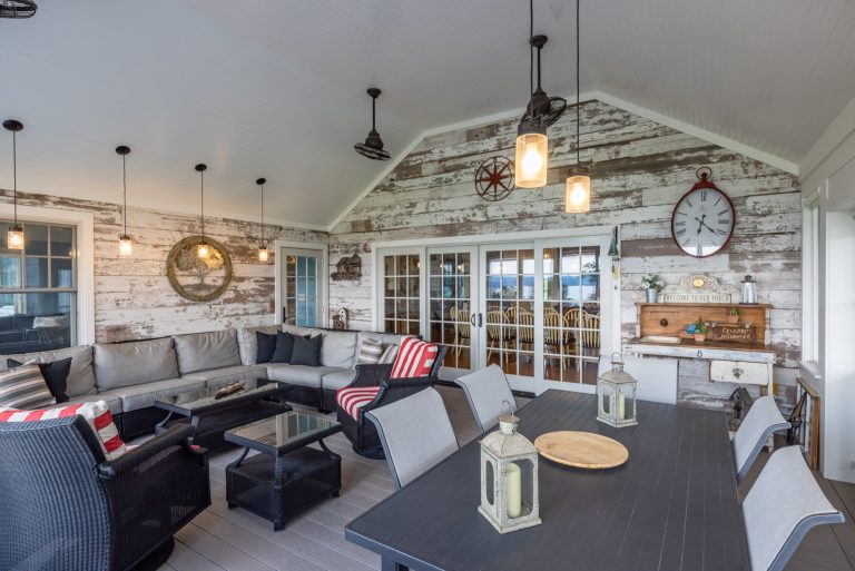 Enclosed back porch with dining and living area.