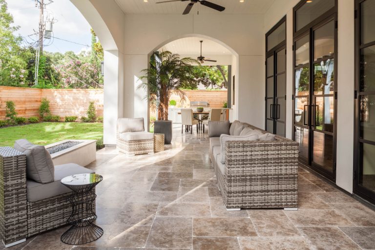 European inspired transitional design home in Tanglewood, Houston TX. Expansive outdoor living, wine cellar, reclaimed beams and master balcony. Photo by TK Images by Design DCA | Outdoor Photos | Porch | Landscaping | Landscape Design | Outdoor Living Space | Porch Design Ideas | Outdoor Living Space Ideas | Backyard Design