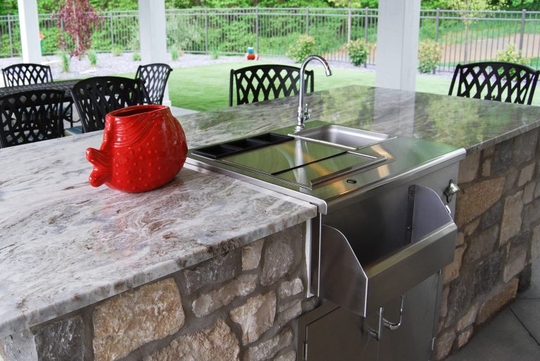 Example of a backyard patio kitchen design in Grand Rapids