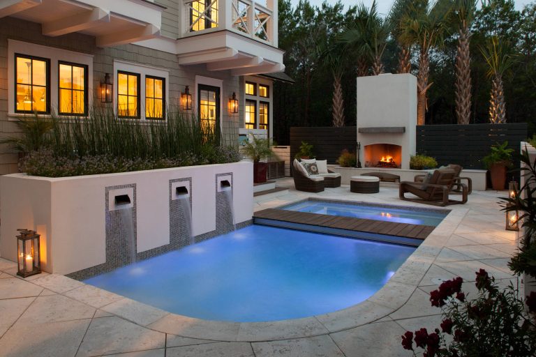 Example of a beach style backyard custom-shaped pool design in Miami