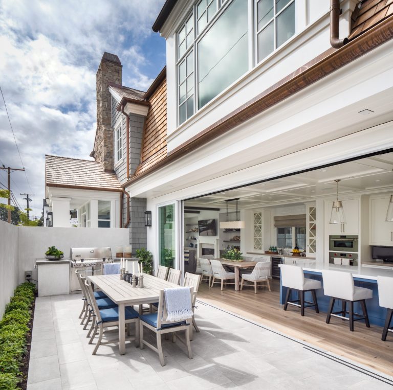 Example of a beach style backyard patio kitchen design in Orange County with no cover