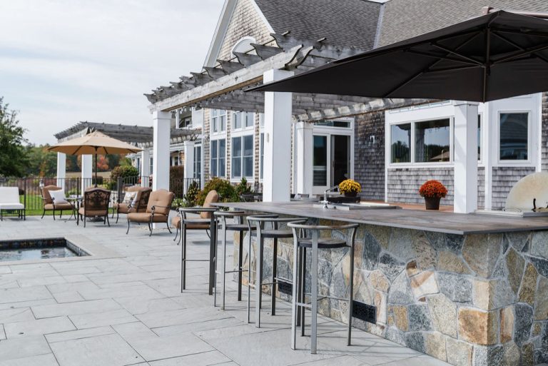 Example of a beach style backyard patio kitchen design in Other