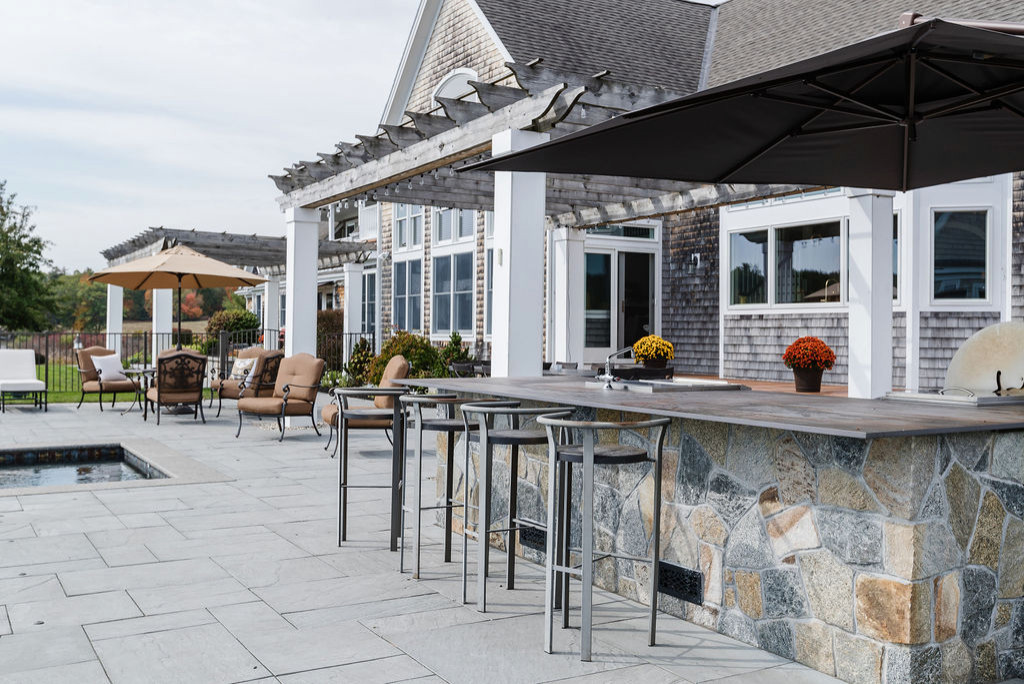 Example of a beach style backyard patio kitchen design in Other